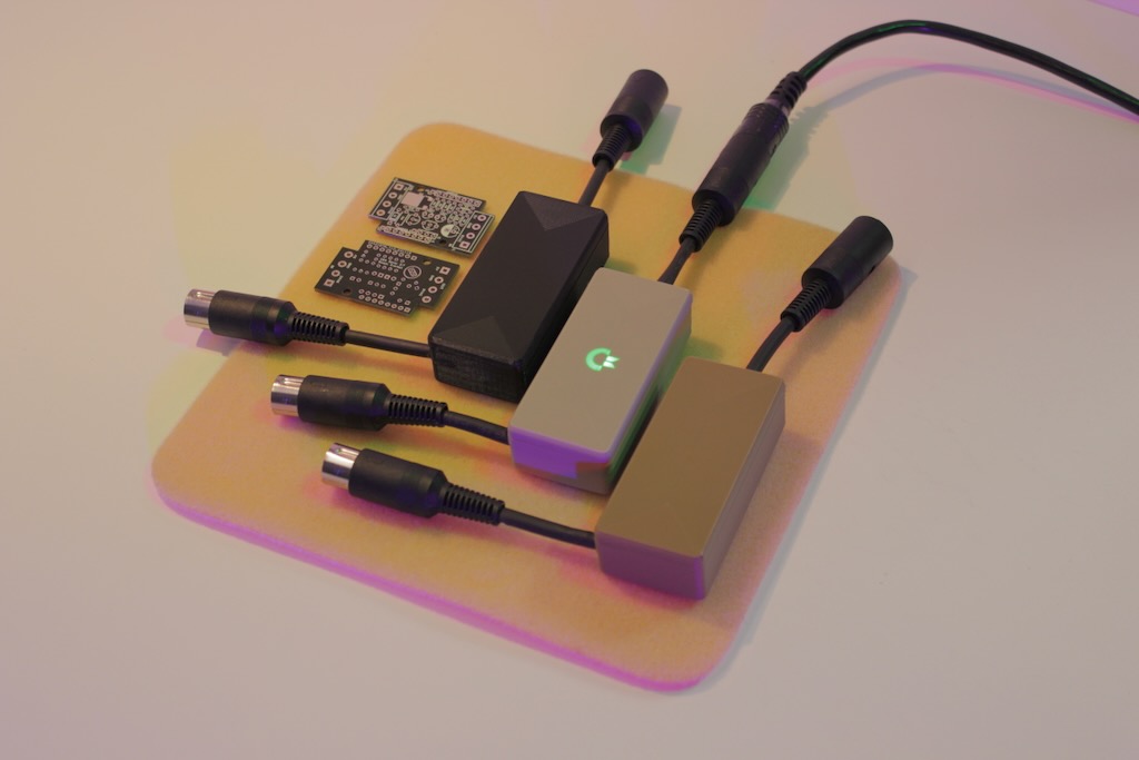 Small-batch run of custom PCBs, printed housings, and assembled cable harnesses on a workbench